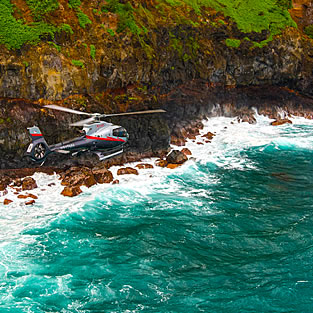 Helicopter flying over the coast of Maui